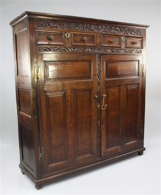 A William III carved oak parlour cupboard, W.5ft 2in.